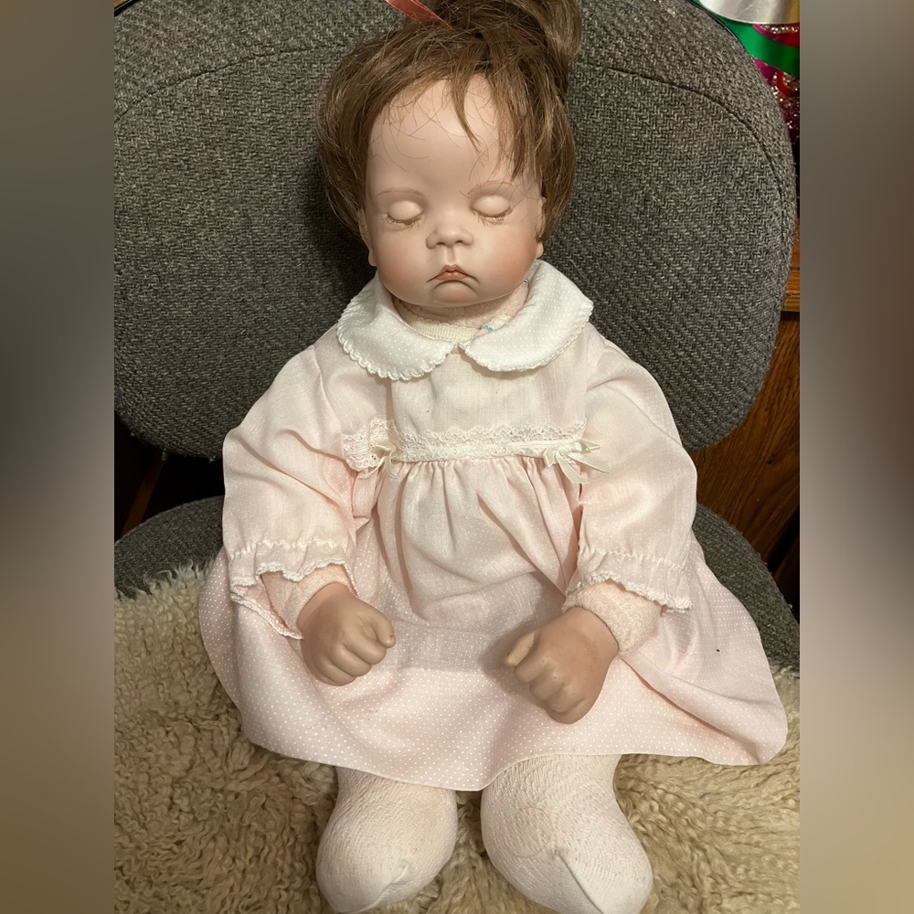 Weighted porcelain doll